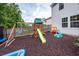 A outdoor playset and pool sit on woodchips next to the home's vinyl siding at 9836 Black Tupelo Ln, Ladson, SC 29456