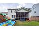 Spacious backyard showing a covered patio and a variety of outdoor toys at 9836 Black Tupelo Ln, Ladson, SC 29456