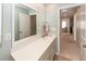 Bathroom featuring a large mirror, a vanity with a white countertop, and tile flooring at 9836 Black Tupelo Ln, Ladson, SC 29456