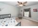 Bright Bedroom with carpet, ceiling fan, window, and neutral color scheme at 9836 Black Tupelo Ln, Ladson, SC 29456