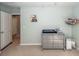 Neutral-toned Bedroom featuring a dresser, decor, and access to another room at 9836 Black Tupelo Ln, Ladson, SC 29456