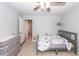 Bright Bedroom with carpet, ceiling fan, and closet at 9836 Black Tupelo Ln, Ladson, SC 29456