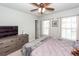 Bedroom with carpet, large windows, and ceiling fan at 9836 Black Tupelo Ln, Ladson, SC 29456
