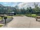 Community area with picnic tables, barbecue grills and a playground at 9836 Black Tupelo Ln, Ladson, SC 29456