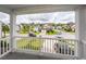 Charming front porch view of a tree lined street with well-maintained homes and landscaping at 9836 Black Tupelo Ln, Ladson, SC 29456