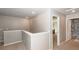 Hallway with neutral walls and carpet, leading to various rooms in the house at 9836 Black Tupelo Ln, Ladson, SC 29456