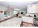 Open kitchen with a granite island overlooking the living area, perfect for entertaining at 9836 Black Tupelo Ln, Ladson, SC 29456