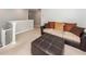 Comfortable living room featuring carpet and a plush sofa with decorative pillows at 9836 Black Tupelo Ln, Ladson, SC 29456