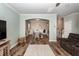 Bright living room showcasing an open floor plan with hardwood floors and stylish furnishings at 9836 Black Tupelo Ln, Ladson, SC 29456