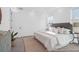 Bedroom with large bed, stylish decor, and a view to an ensuite bathroom at 1023 Marsh Harrier Dr # Cc3-3-5P, Ravenel, SC 29470