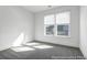 Clean, empty bedroom features a neutral carpet and white trim at 1023 Marsh Harrier Dr # Cc3-3-5P, Ravenel, SC 29470