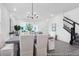 Open-concept dining area adjacent to the living room and staircase, perfect for modern living and entertaining at 1023 Marsh Harrier Dr # Cc3-3-5P, Ravenel, SC 29470