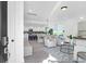 Bright, open-concept living area with modern furnishings, light gray wood floors, and an eat-in kitchen at 1023 Marsh Harrier Dr # Cc3-3-5P, Ravenel, SC 29470