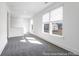 Light-filled loft area featuring plush carpeting and natural light, creating a versatile and inviting space at 1023 Marsh Harrier Dr # Cc3-3-5P, Ravenel, SC 29470