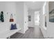 Organized mud room with bench, hooks, and storage, providing a convenient entry point to the home at 1023 Marsh Harrier Dr # Cc3-3-5P, Ravenel, SC 29470