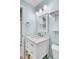 Clean bathroom featuring modern wainscoting, a vanity, mirror, and stylish fixtures at 1032 Windward Rd, Charleston, SC 29412