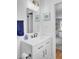 Nicely updated bathroom featuring a vanity, mirror, lighting, and modern fixtures at 1032 Windward Rd, Charleston, SC 29412