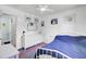 Clean bedroom with hardwood floors, a single bed, and white trim at 1032 Windward Rd, Charleston, SC 29412