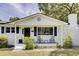 Inviting front porch with seating and decorative plants at 1032 Windward Rd, Charleston, SC 29412