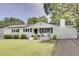 Charming home with a well-manicured front yard and solar panels at 1032 Windward Rd, Charleston, SC 29412