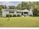 Charming home with a well-manicured front yard and solar panels at 1032 Windward Rd, Charleston, SC 29412