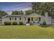 Charming home with a well-manicured front yard and solar panels at 1032 Windward Rd, Charleston, SC 29412