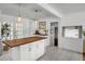 Bright kitchen features a central island with butcher block top, white cabinets, modern appliances, and stylish pendant lighting at 1032 Windward Rd, Charleston, SC 29412