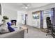 Comfortable living room with gray sofa, patterned curtains, and wall-mounted television at 1032 Windward Rd, Charleston, SC 29412