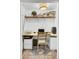 A compact yet functional office nook featuring a desk, shelving, and storage solutions at 1032 Windward Rd, Charleston, SC 29412