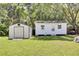 Backyard features two storage sheds with green grass at 1032 Windward Rd, Charleston, SC 29412