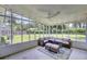 Inviting sunroom with neutral toned furniture, ceiling fan, and beautiful views at 1032 Windward Rd, Charleston, SC 29412