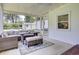 Comfortable sunroom features wicker furniture, ceiling fan, and bright light at 1032 Windward Rd, Charleston, SC 29412
