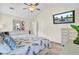 Cozy bedroom with high ceilings, neutral decor, and a mounted television at 104 Lancaster Ct, Goose Creek, SC 29445