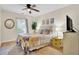 Inviting bedroom with stylish decor, soft lighting, and a view of the outdoors at 104 Lancaster Ct, Goose Creek, SC 29445