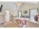 Bright bedroom featuring a ceiling fan, plush rug, and large windows for natural light at 104 Lancaster Ct, Goose Creek, SC 29445