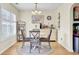 Bright dining room featuring a round table, chandelier, and elegant decor at 104 Lancaster Ct, Goose Creek, SC 29445