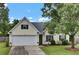Charming home with a well-maintained lawn, two-car garage, and traditional architecture at 104 Lancaster Ct, Goose Creek, SC 29445