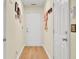 Hallway with hardwood floors, white trim, and neutral walls, offering a clean aesthetic at 104 Lancaster Ct, Goose Creek, SC 29445