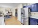 Open concept: stainless steel refrigerator near dining area with seating for four at 104 Lancaster Ct, Goose Creek, SC 29445
