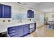 Bright kitchen featuring navy cabinets, stainless appliances, and marble countertops at 104 Lancaster Ct, Goose Creek, SC 29445