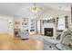 Cozy living room with a fireplace, hardwood floors, and ample natural light at 104 Lancaster Ct, Goose Creek, SC 29445