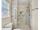 Luxurious marble shower with glass enclosure, grab bars, and built-in niche at 104 Lancaster Ct, Goose Creek, SC 29445