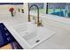 Farmhouse sink with modern faucet and white countertop providing a clean look at 104 Lancaster Ct, Goose Creek, SC 29445
