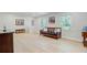 Bright, open living room with hardwood floors, built-in shelving, and contemporary decor at 108 E Walker Dr, Summerville, SC 29483