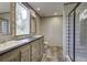 Bright bathroom with double sinks, modern fixtures, and a glass-enclosed shower for a clean, contemporary feel at 108 Wisteria Falls Ln, Saint Stephen, SC 29479