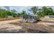 New single-story home featuring a covered porch and neutral siding in a community undergoing landscape installation at 108 Wisteria Falls Ln, Saint Stephen, SC 29479