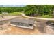New construction home featuring siding, a covered porch, and a freshly laid driveway in a treed community at 108 Wisteria Falls Ln, Saint Stephen, SC 29479