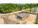 New construction home featuring siding, a covered porch, and a freshly laid driveway in a treed community at 108 Wisteria Falls Ln, Saint Stephen, SC 29479