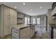 Bright kitchen with a large island, stainless steel sink, and wooden countertops at 108 Wisteria Falls Ln, Saint Stephen, SC 29479