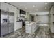 Open kitchen with stainless steel appliances, ample cabinet space, and a large island perfect for entertaining at 108 Wisteria Falls Ln, Saint Stephen, SC 29479